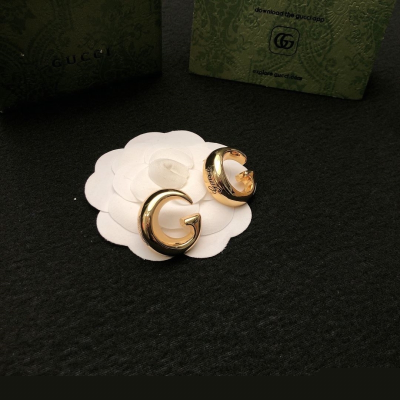 G*u*i earrings